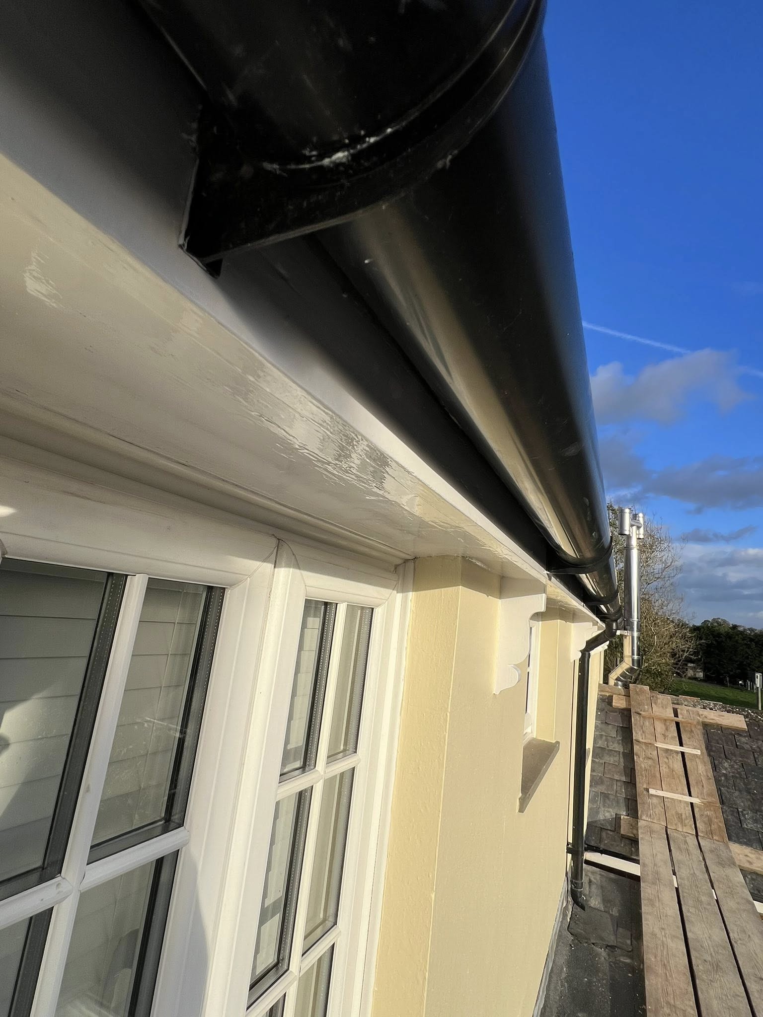 Black retractable awning on building exterior